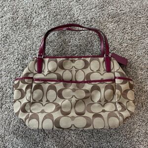 Coach brown and burgundy Canvas Diaper Bag, Classic “C” print.